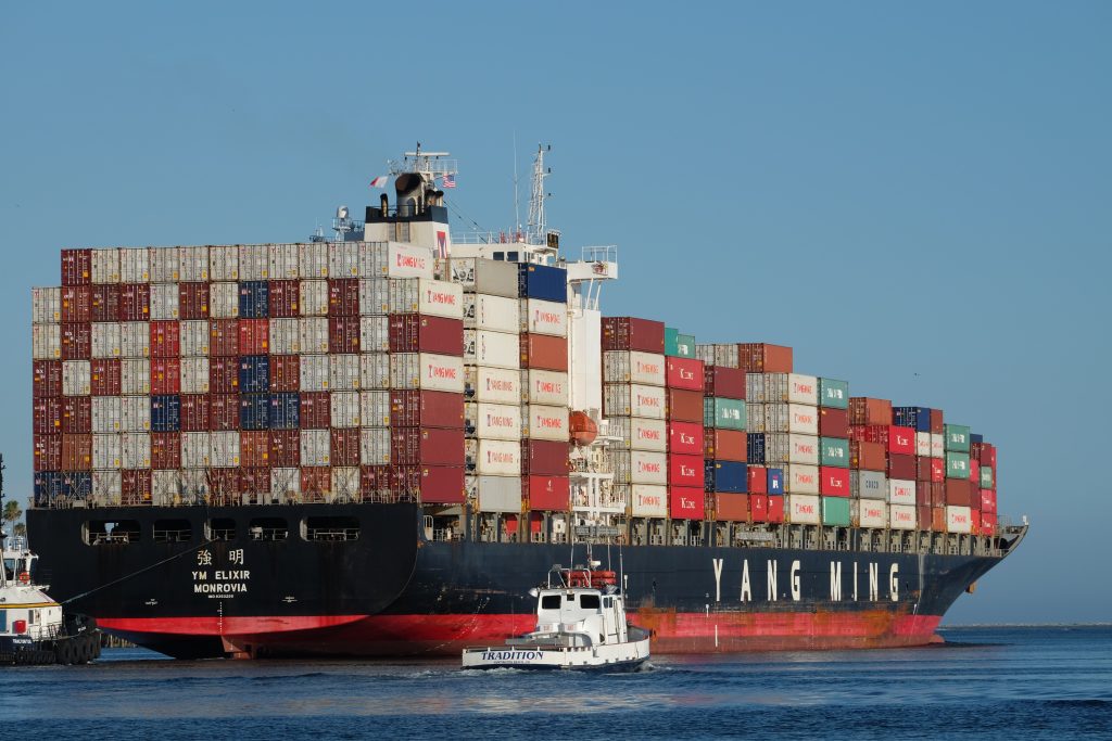 A picture of a container ship carrying cargo in Asia.